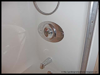 contractor's plate installed on shower control