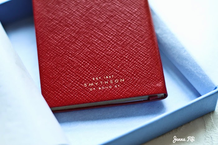 Red leather smythson panama notebook with gold palm tree's