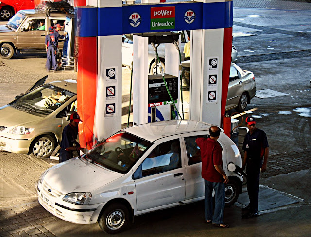 petrol being filled at gas station