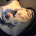 3D snail tattoo on back 