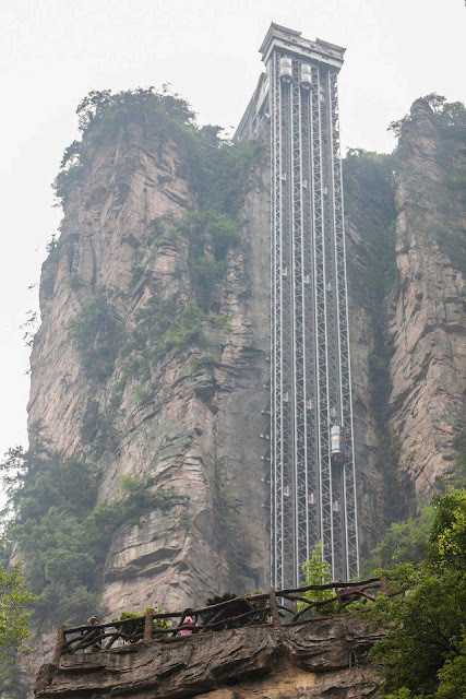 If you suffer from a fear of heights, perhaps this one's not for you. The Bailong Elevator, also known as the Hundred Dragons Elevator, carries tourists 1,070ft (330m) up the side of a massive sandstone column in a mountain range in China's Hunan Province. Riding the glass lift, which carries up to 50 people at a time or 1,380 an hour, offers jaw-dropping, not to say vertiginous, views down to the bottom of the rocky mountain range in the Wulingyuan area of Zhangijiajie. Work began on the lift, which cost 120m yuan, or around £12m, in 1999 and finished in 2002. The project met with fierce criticism from environmentalists who were angry that it was sited in the middle of a World Heritage Site.Lift shafts and tunnels had to be dug into the quartz sandstone column chosen from thousands in the area, and earthquake detectors installed so that the lifts (there are three of them) could be evacuated quickly in case of disaster. Those in favour of the project said that the elevators, which are said to boast the biggest passenger capacity in the world, saved the mountain trails from excess traffic. But protestors said the area, which attracts 5m visitors each year, was already saturated with tourists and did not need another attraction to boost that number further.