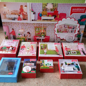 Selection of Lundby dolls' house and furniture sets in packaging.