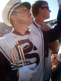 Blue Band horn player in the sunshine