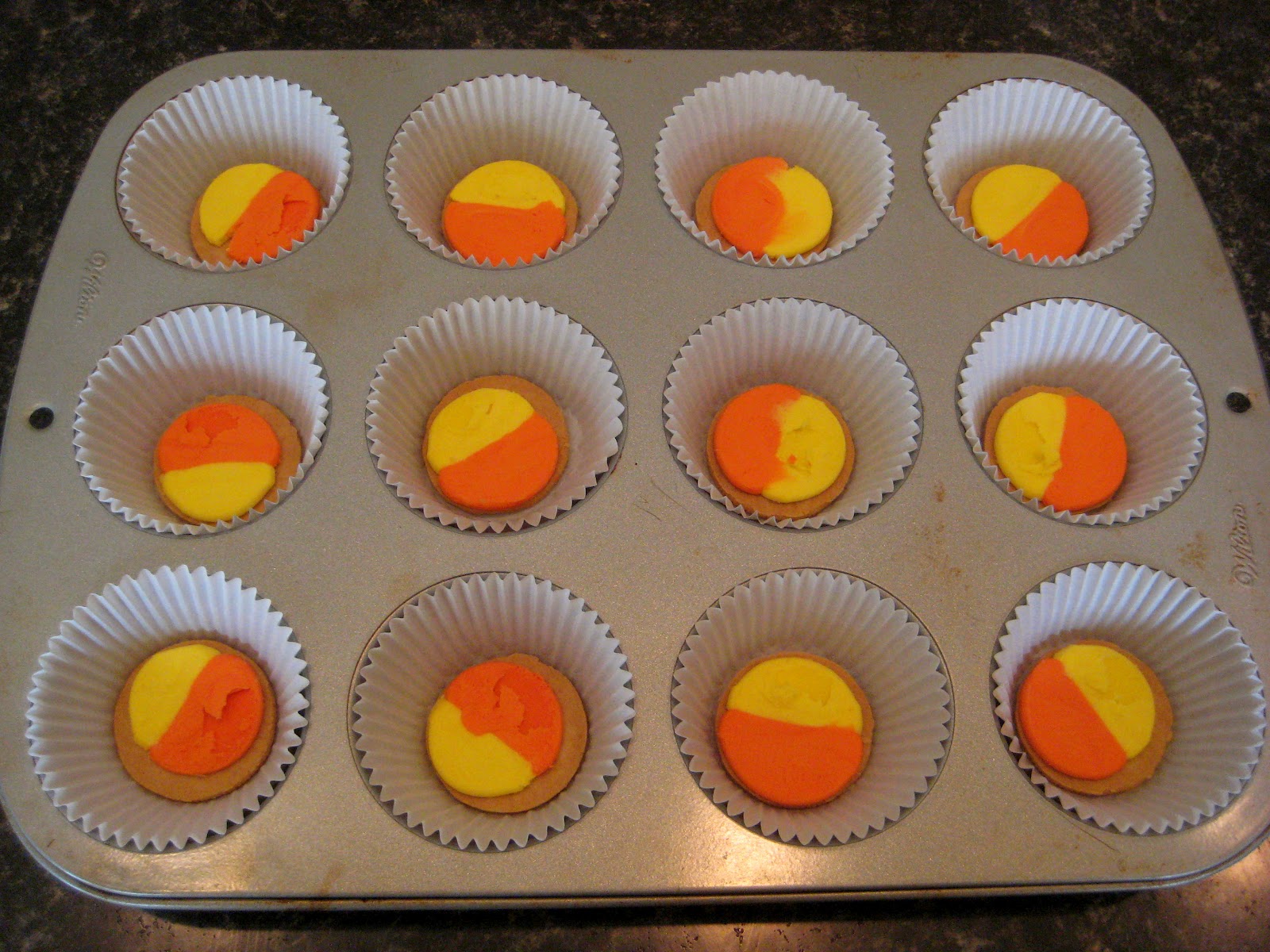 cue the confetti: candy corn oreo cupcakes