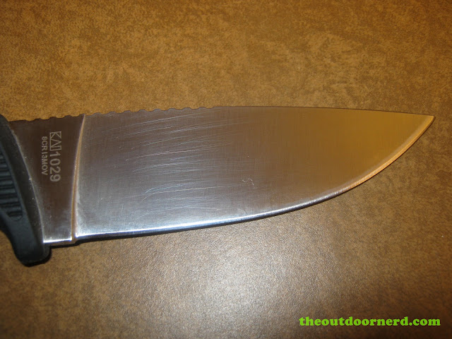 Kershaw Bear Hunter II closeup of blade scratches Kershaw Bear Hunter II closeup of blade scratches