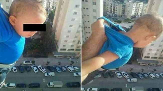 Φωτό που κόβει την ανάσα: Αλγερινός κρεμά το παιδί του στο κενό για... 1.000 likes στο Facebook! Φωτό που κόβει την ανάσα: Αλγερινός κρεμά το παιδί του στο κενό για... 1.000 likes στο Facebook!