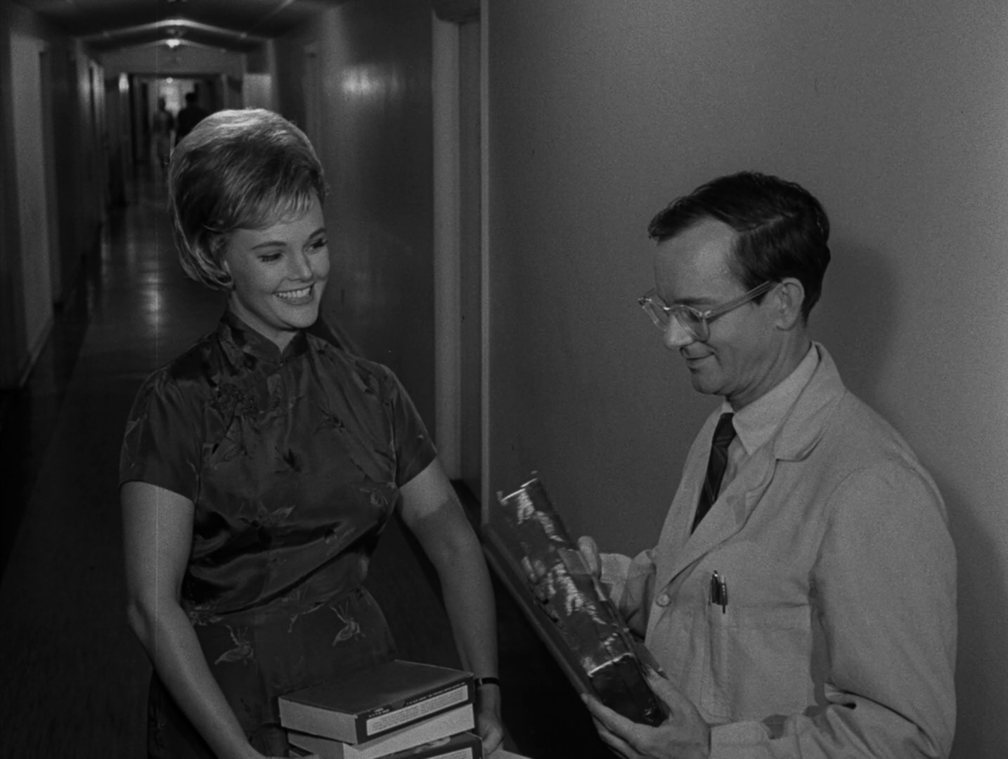 Nan Peterson plays an unnamed secretary in her third and final TZ appearanc...