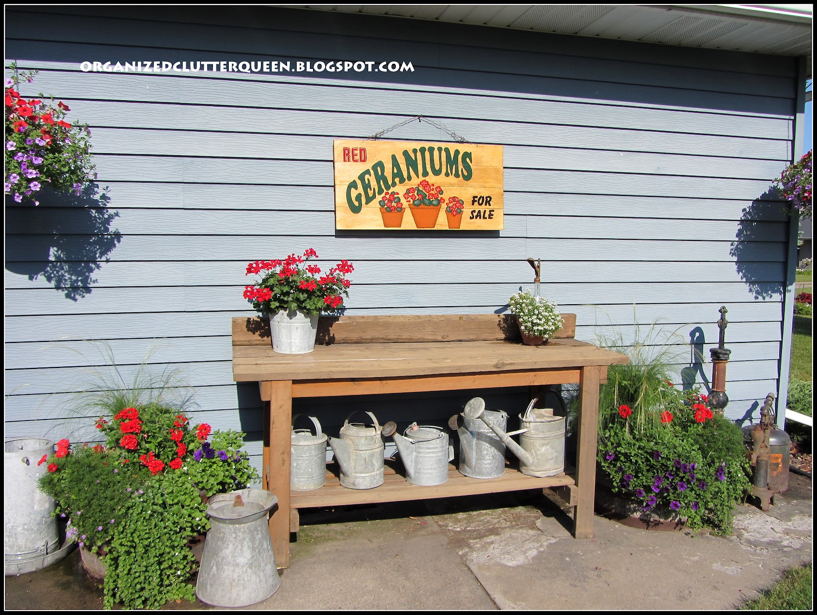 Potting Bench, Whiskey Barrels, and Hanging Pails Organized Clutter