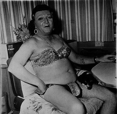 Hermaphrodite and Dog in Carnival , Diane Arbus