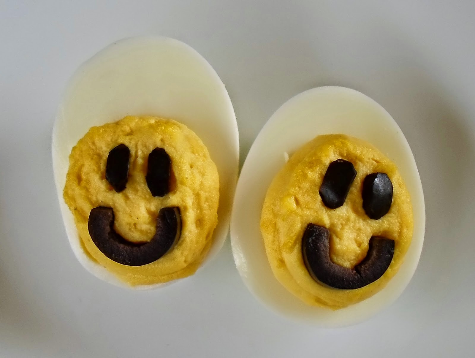 http://happierthanapiginmud.blogspot.com/2014/08/smiley-face-deviled-eggs.html