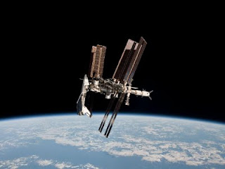 STS-134 Endeavor docked with ISS May 23, 2011 as seen by Soyuz capsule. Image courtesy of NASA.