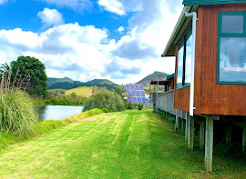 Creek by the side & sea at the front.