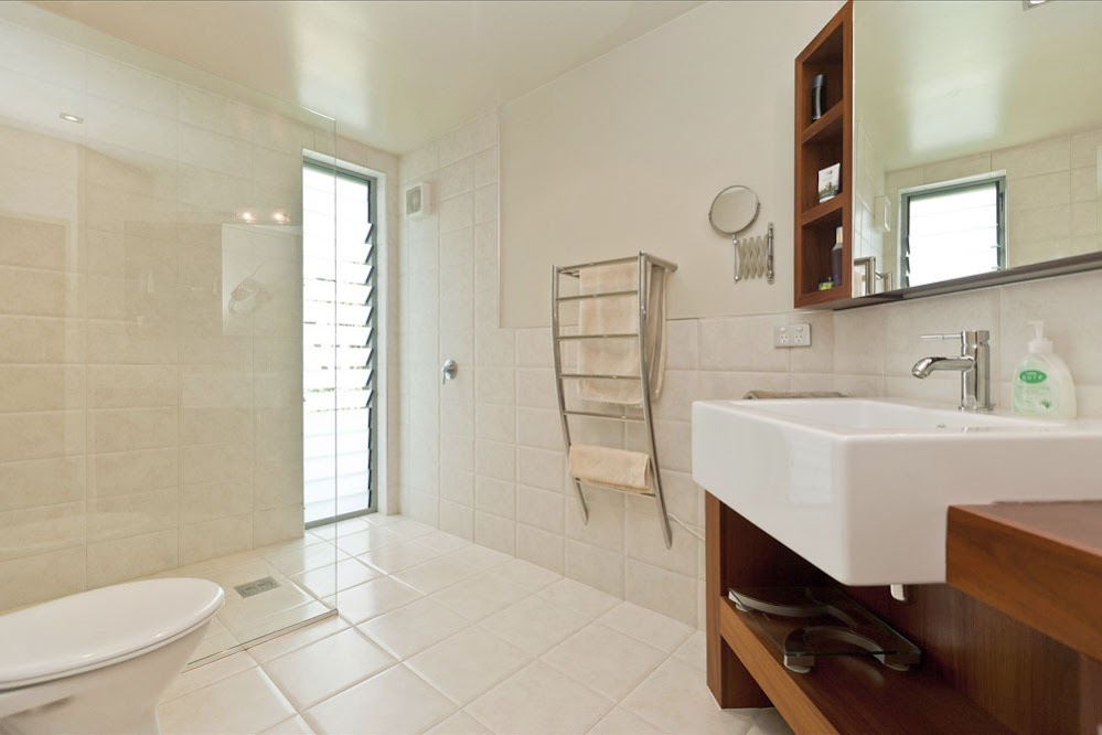 Photo of modern sink and other furniture in the bathroom