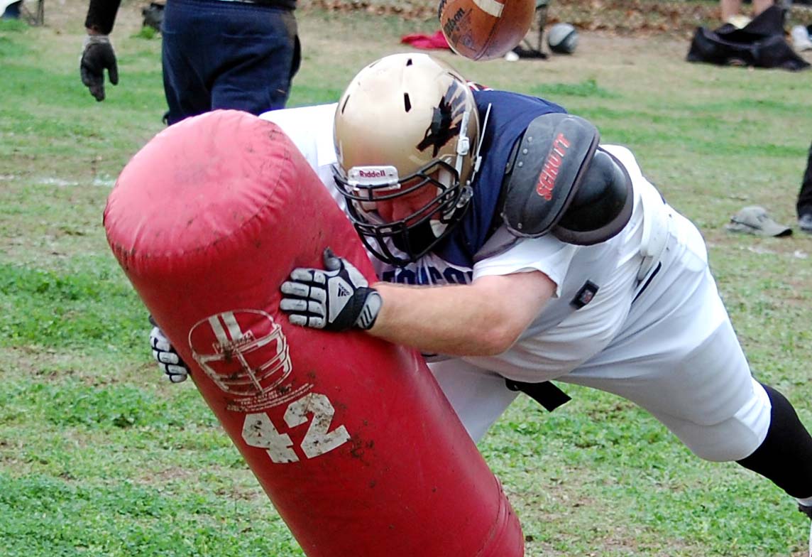 Women Who Play Football Getting Low; Tackling Dummies; Learning from