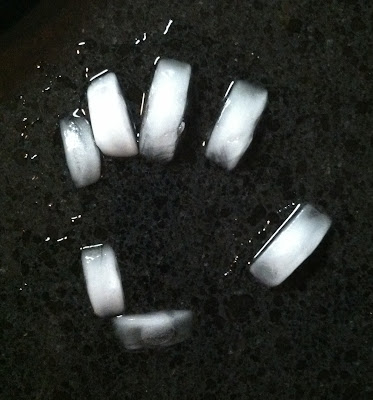 ice cube hand melts before my eyes making a puddle