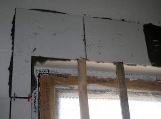 Propped up tiles above the window Propped up tiles above the window