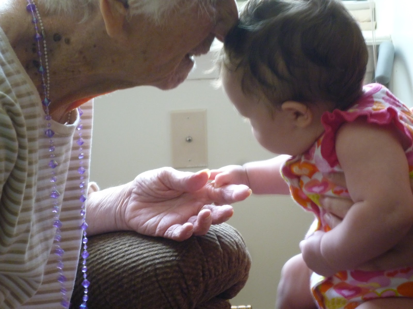Great-grandma Raynor (Mary Cronin Raynor) and great-granddaughter Elena (Marielena Hall) hold hands the day they finally meet, June 28, 2013