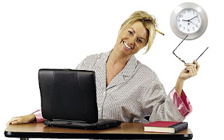 Girl in front of a computer in her pajamas