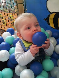 soft play, ball bit, baby in ball pit, eating ball