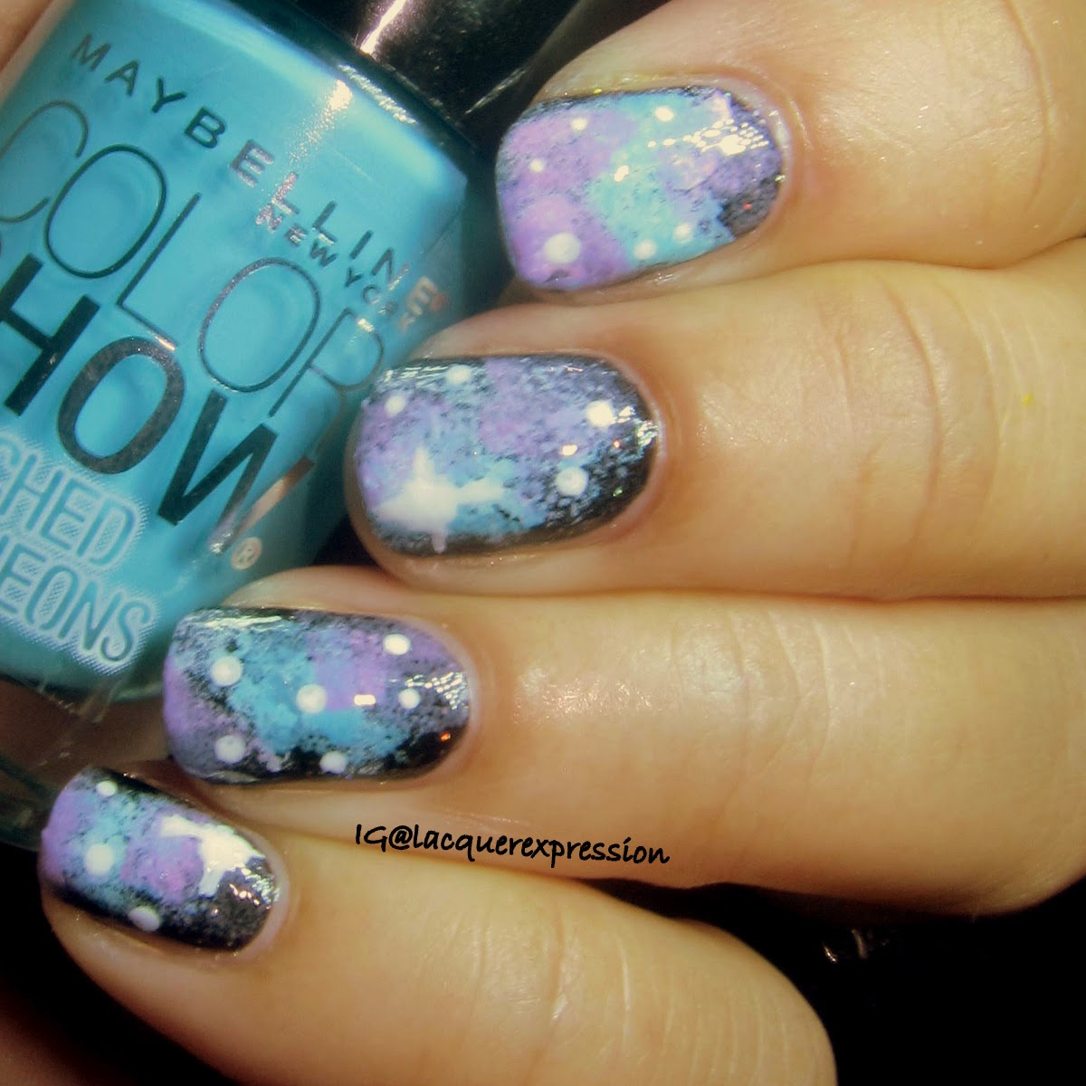 Galaxy nail art using day glow teal polish by maybelline
