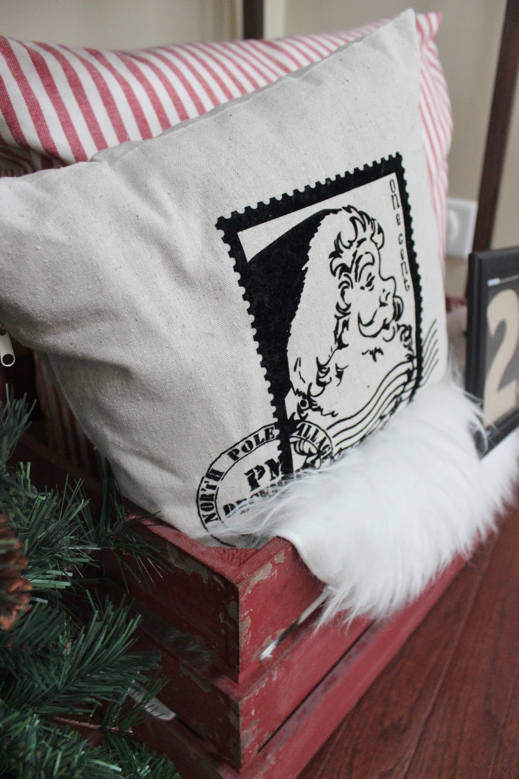 Holiday Decor: Rustic Crate Dressed Up with Santa Pillow and Faux Sheepskin Rug