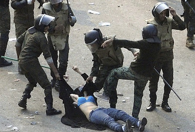 egyptian army soldiers dragging woman protester