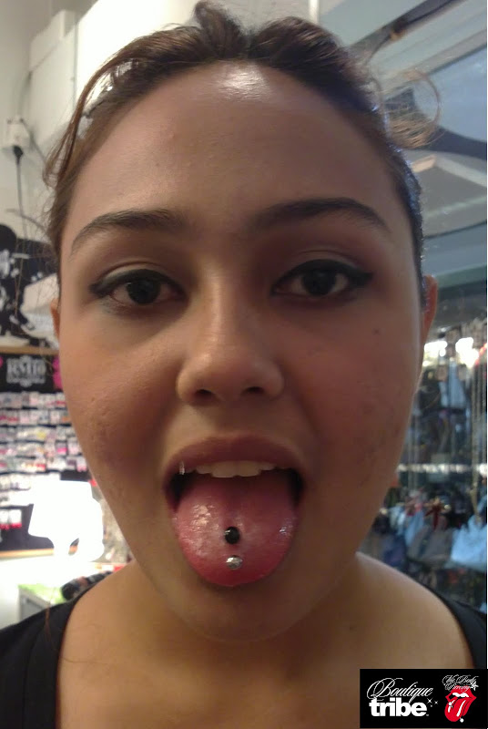 Tongue piercing title=