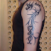TATUAJE DE DRAGON TRIBAL EN ESPALDA Y BRAZO
