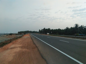 Highway NH66 passing through Maravanthe beach in Trasi and the Suparnika river.