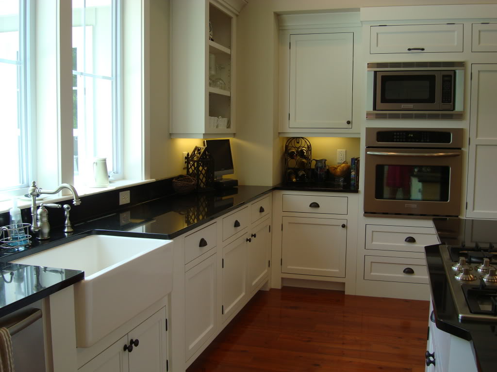 Adding beadboard to kitchen cabinets Black and White Kitchen with Farmhouse Sink