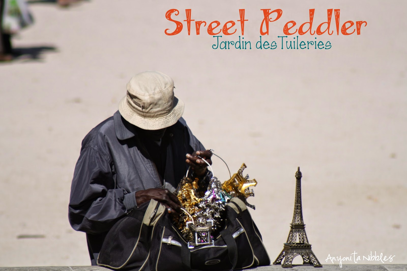 A street peddlar in Paris, France by Anyonita Nibbles