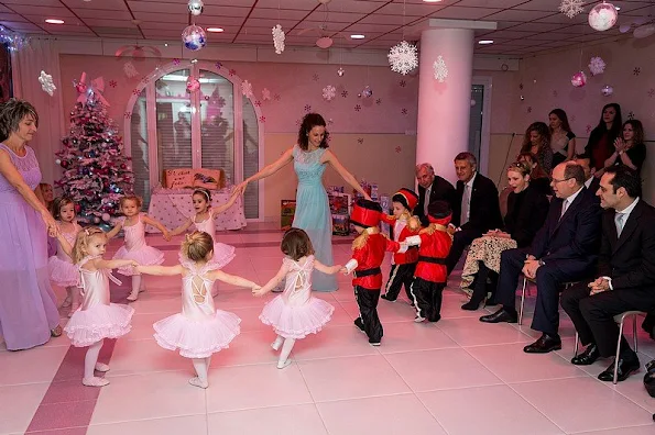 Prince Albert and princess Charlene of Monaco presented gifts to old people and children at "Red Cross" Monaco branch