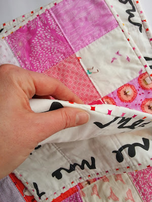 Up close of hand sewn binding detail