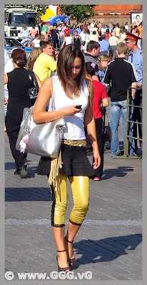 Girl in yellow breeches on the street  