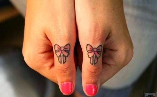 Cute Bow Finger Tattoo Designs And Ideas - dashingamrit