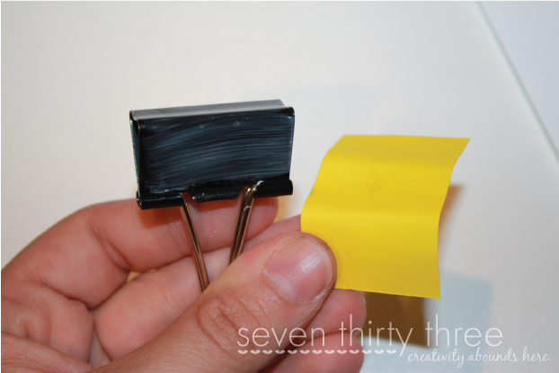 Cover binder clip with Mod Podge and adhere strip of paper.