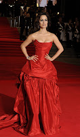 Berenice Marlohe glamorous in a red gown on the red carpet