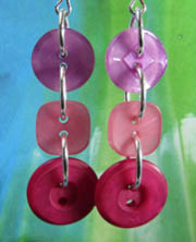 Fab Party Earrings Flattering pink drop dangle earrings have 3 detailed buttons linked in long strand with silver loops