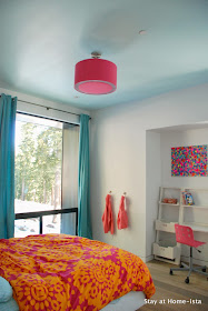 Bright pink, orange and teal in a modern house makes the perfect room for a growing girl.