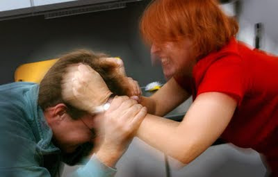 woman grabs man - Dating Abusive Women