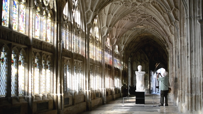 Gloucester Cathedral Hogwarts school corridor stained glass windows mand taking photo