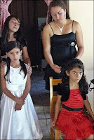 Younger girls in the wedding party getting hair prepared young girls having their hair braided