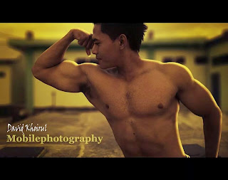 man in Asia with muscle topless his biceps triceps