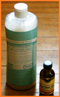 Dr. Bronner's pure castile soap, unscented baby-mild and a small bottle of tea tree oil