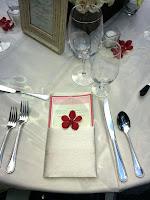 Wedding reception place setting - Photo by Patricia Stimac, Seattle Wedding Officiant Red and white wedding table place setting - Photo by Patricia Stimac, Seattle Wedding Officiant
