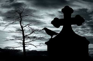 silhouette of a grave stone with a raven on top