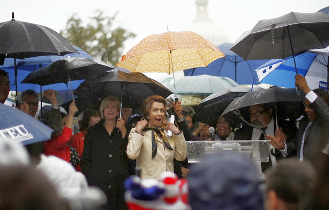 U.S. House Minority Leader Nancy Pelosi (D-CA) prepares to address protesters calling for an end to the U.S. government shut down on Capitol Hill in Washington, October 10, 2013. U.S. House of Representatives Republicans are considering signing on to a short-term increase in the government's borrowing authority to buy time for negotiations on broader policy measures, according to a Republican leadership aide. REUTERS/Jason Reed (UNITED STATES - POLITICS BUSINESS TPX IMAGES OF THE DAY- think IN pictures @1WORLDCommunity)
