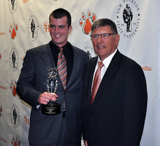 Tyler Eberhart, a criminal justice major and president of the SGA, shares the Sammy Award with Dr. Vincent Webb, Dean of the College of Criminal Justice.