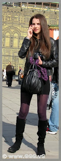 Girl in the black mini skirt on the street 