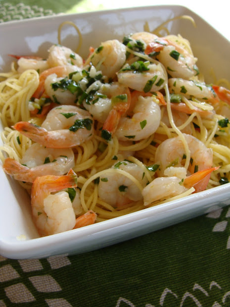 cooking shrimp scampi over